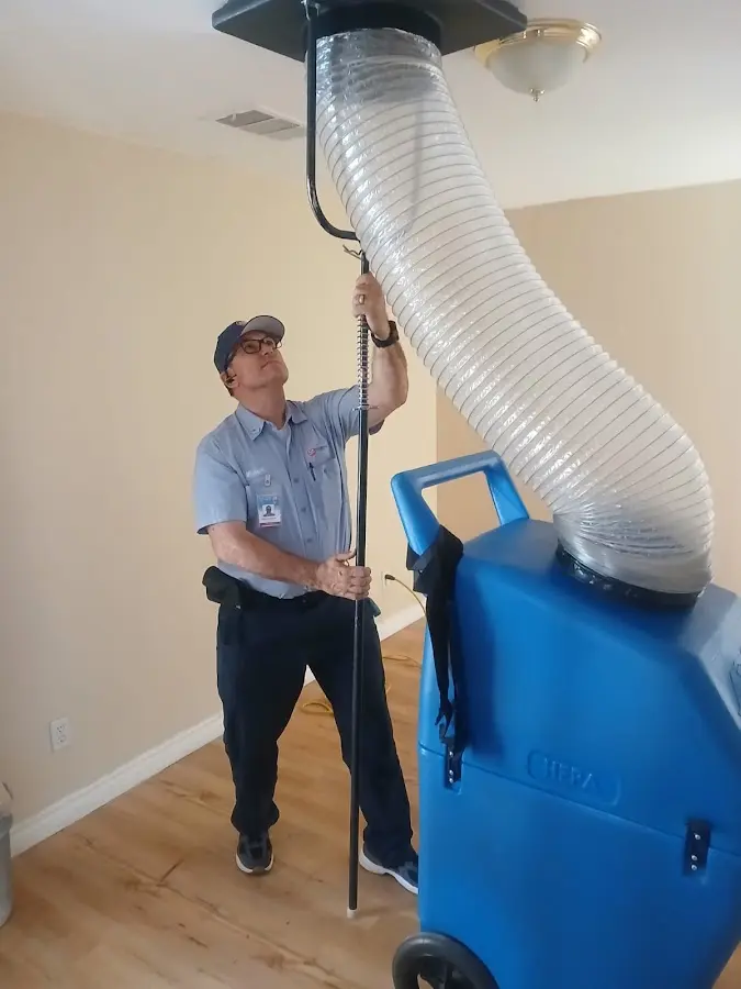 Furnace Tune-Up technician using HEPA equipment in San Tan Valley
